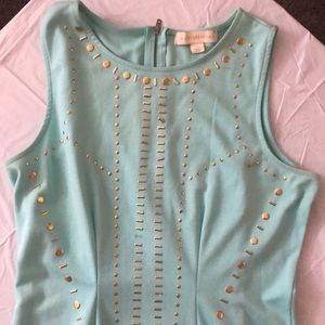 Nicki Minaj teal dress with gold accents